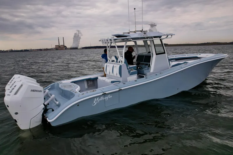 Slide: The Image of 2025 Yellowfin 36 Offshore boat on water, featuring Mercury engines, overcast sky. - 5