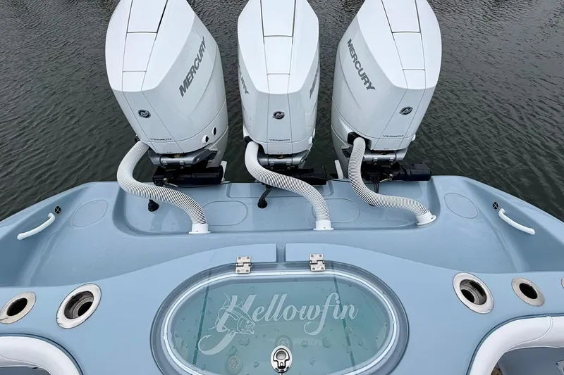 Slide: The Image of 2025 Yellowfin 36 Offshore boat with triple Mercury engines on water. - 8