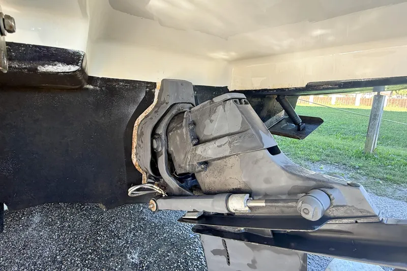 Slide: The Image of 2006 Sea Ray 270 SLX boat on trailer, parked outdoors under clear blue sky. - 10