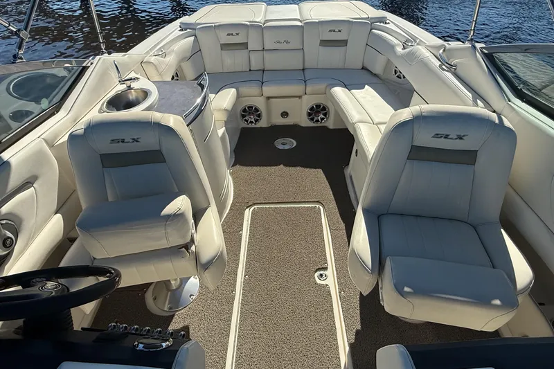 Slide: The Image of Close-up of a 2006 Sea Ray 270 SLX boat's outdrive on a gravel surface. - 12