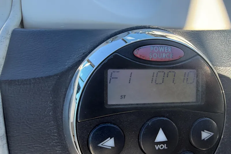 Slide: The Image of Dashboard of a 2006 Sea Ray 270 SLX boat with steering wheel and gauges. - 17