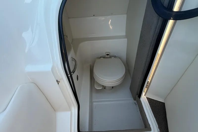 Slide: The Image of Control panel of a 2006 Sea Ray 270 SLX boat with switches and warning label. - 18