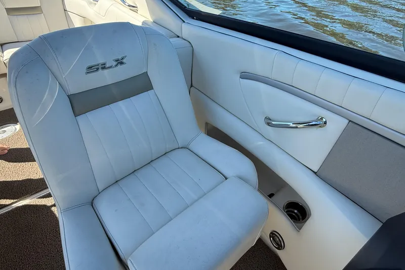 Slide: The Image of 2006 Sea Ray 270 SLX boat dashboard with water view in the background. - 22