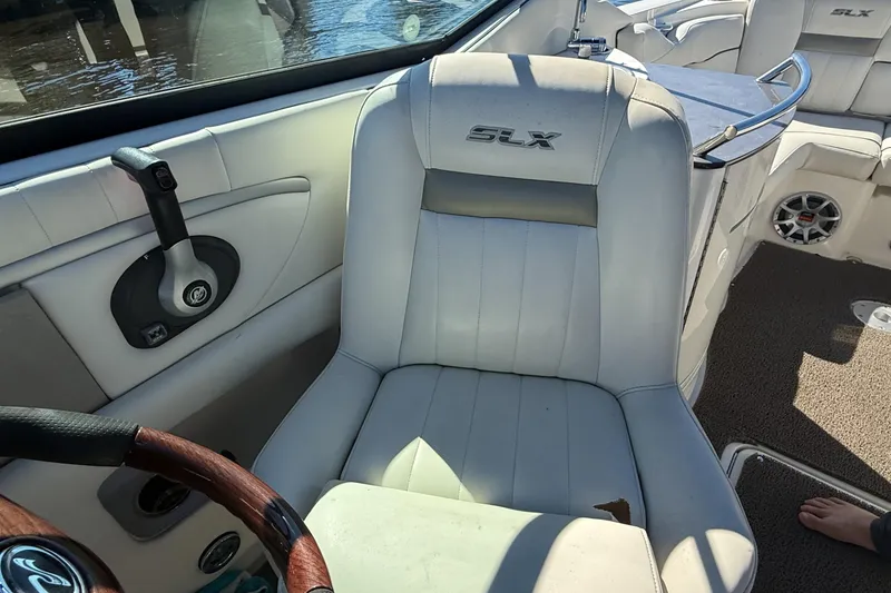 Slide: The Image of 2006 Sea Ray 270 SLX boat interior with sink and seating area. - 23