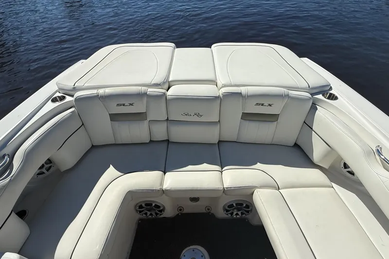 Slide: The Image of 2006 Sea Ray 270 SLX boat interior with white leather seating and chrome accents. - 25