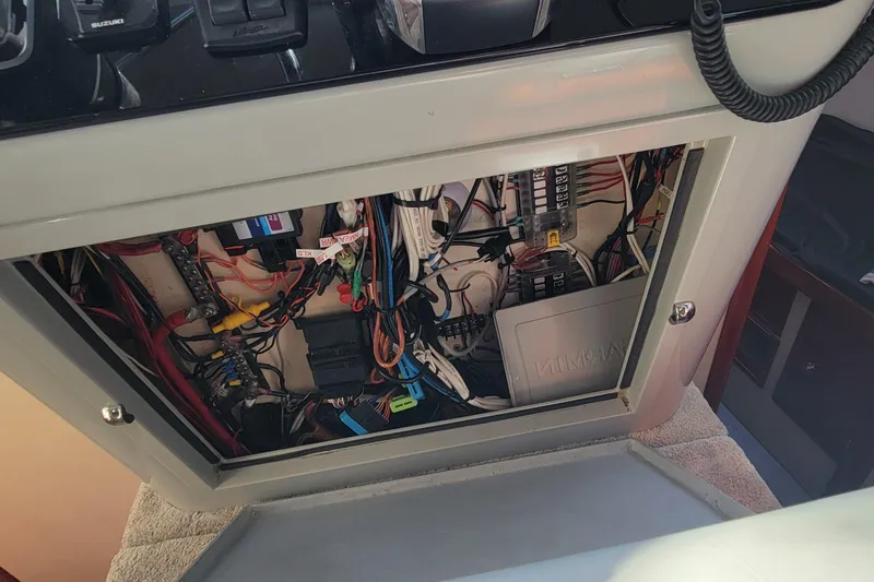 Slide: The Image of Electrical panel of a 2001 Zeta 32 Power Cat, showcasing wiring and components. - 14