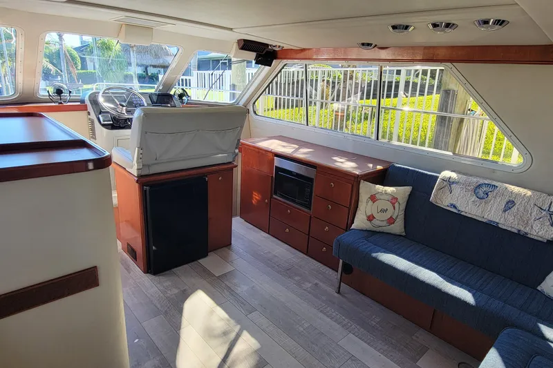 Slide: The Image of Interior of 2001 Zeta 32 Power Cat with seating, helm, and windows. - 17