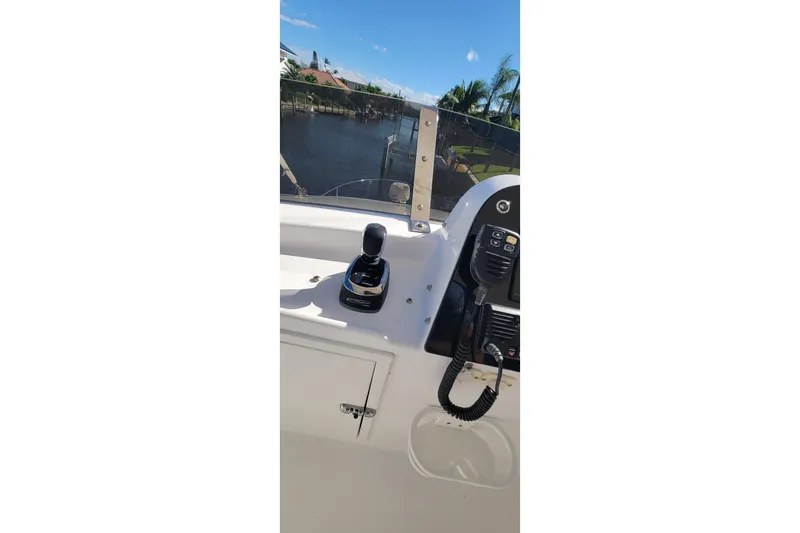 Slide: The Image of Control panel of 2001 Zeta 32 Power Cat boat with water view. - 19