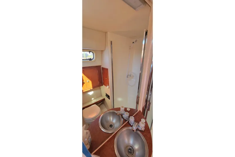 Slide: The Image of 2001 Zeta 32 Power Cat bathroom with dual sinks and shower. - 28