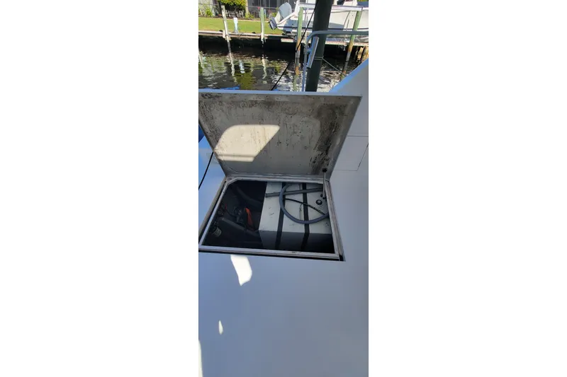 Slide: The Image of Open hatch on 2001 Zeta 32 Power Cat, revealing internal compartment. - 29