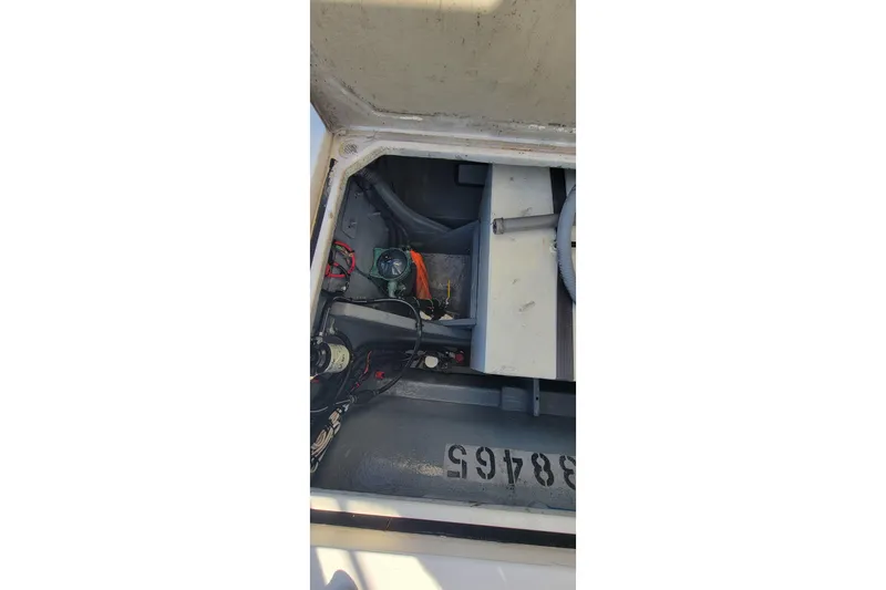 Slide: The Image of Engine compartment of a 2001 Zeta 32 Power Cat boat, showing mechanical components. - 30