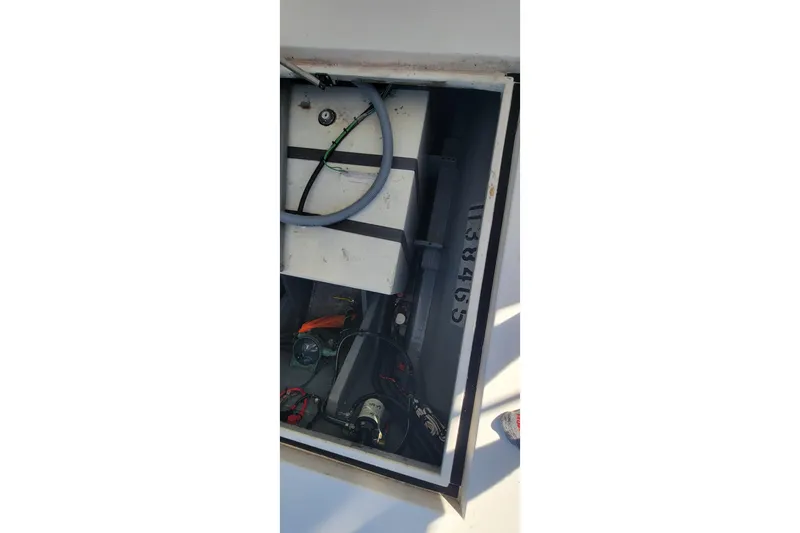 Slide: The Image of Open engine compartment of 2001 Zeta 32 Power Cat boat, showing internal components and wiring. - 31