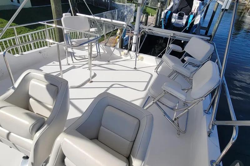Slide: The Image of Spacious deck of 2001 Zeta 32 Power Cat with comfortable seating and table. - 34