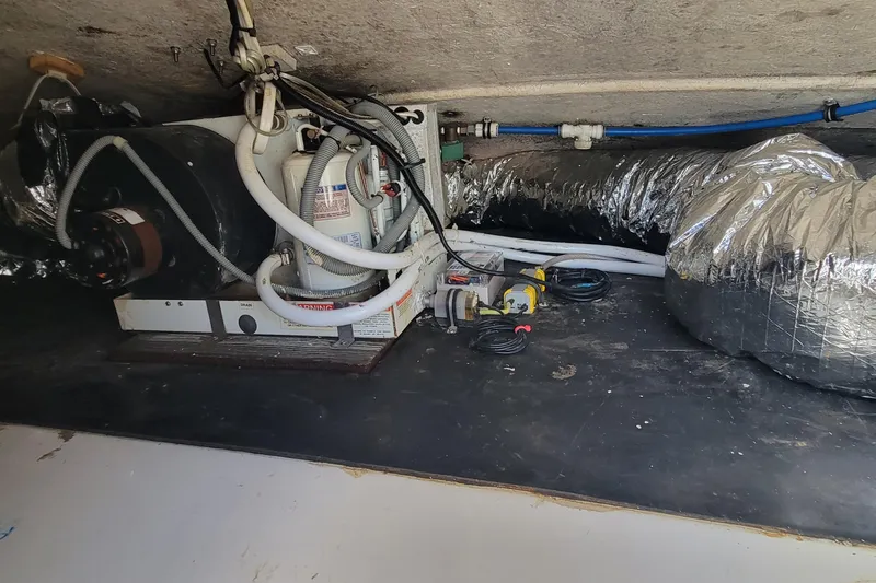 Slide: The Image of Engine compartment of 2001 Zeta 32 Power Cat with visible wiring and ductwork. - 36