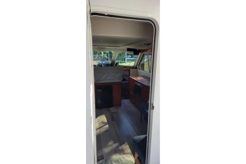 Slide: The Image of Interior view of 2001 Zeta 32 Power Cat, featuring cabin and seating area. - 42