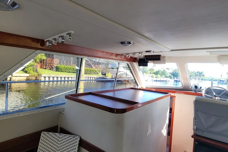 Slide: The Image of Interior of 2001 Zeta 32 Power Cat boat with waterfront view. - 54