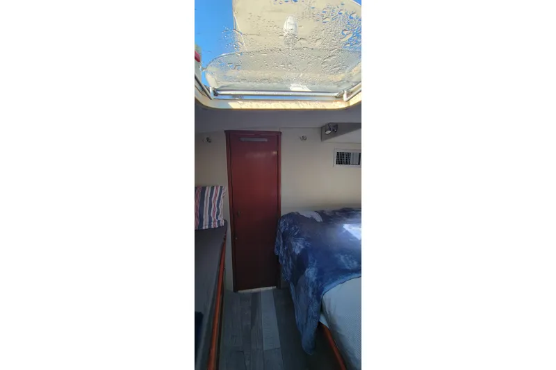 Slide: The Image of Interior cabin of 2001 Zeta 32 Power Cat with skylight and bed. - 59