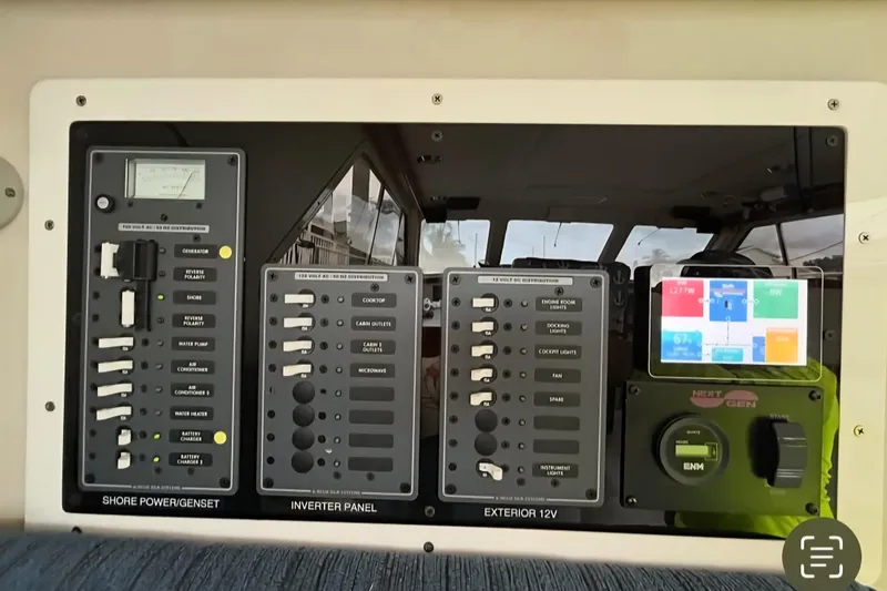 Slide: The Image of Electrical control panel on a 2001 Zeta 32 Power Cat boat. - 7