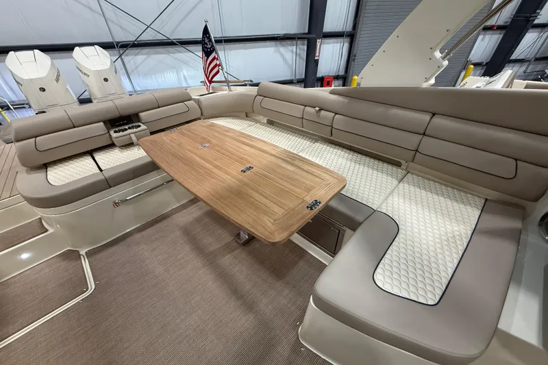 Slide: The Image of Luxurious interior of 2026 Chris-Craft Launch 35 GT with elegant seating and wooden table. - 10