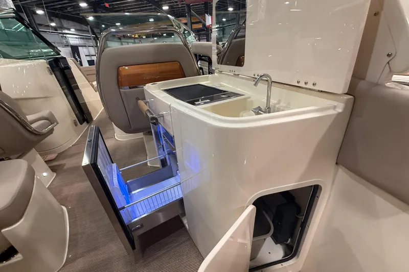 Slide: The Image of 2026 Chris-Craft Launch 35 GT interior with sink and open storage compartments. - 13