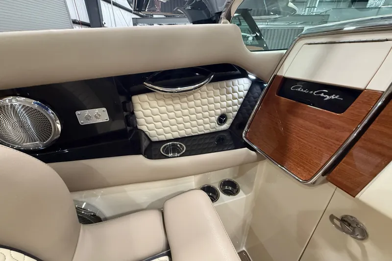 Slide: The Image of Luxurious interior of 2026 Chris-Craft Launch 35 GT with elegant wood and leather accents. - 16