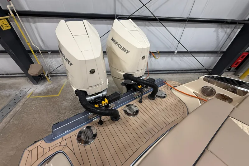 Slide: The Image of 2026 Chris-Craft Launch 35 GT with dual Mercury outboard engines in a garage setting. - 5