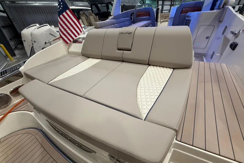 Slide: The Image of 2026 Chris-Craft Launch 35 GT boat interior with luxurious seating and American flag. - 6