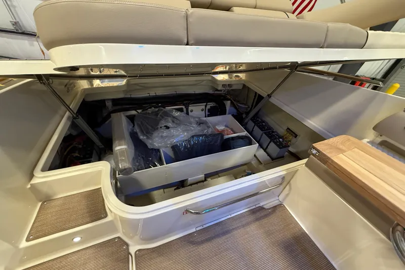 Slide: The Image of 2026 Chris-Craft Launch 35 GT interior storage compartment with open seating and organized equipment. - 9