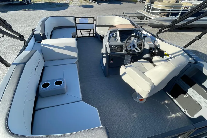 Slide: The Image of 2026 Starcraft GX 16 R boat interior with seating and steering console. - 14