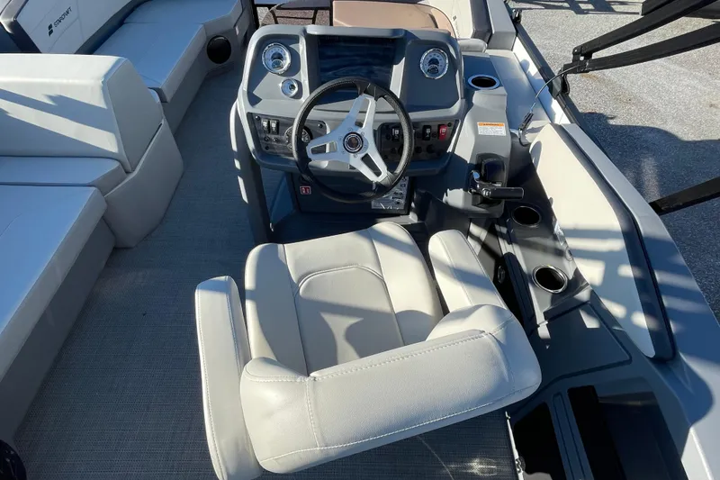 Slide: The Image of Interior of 2026 Starcraft GX 16 R boat with steering wheel and seating. - 15