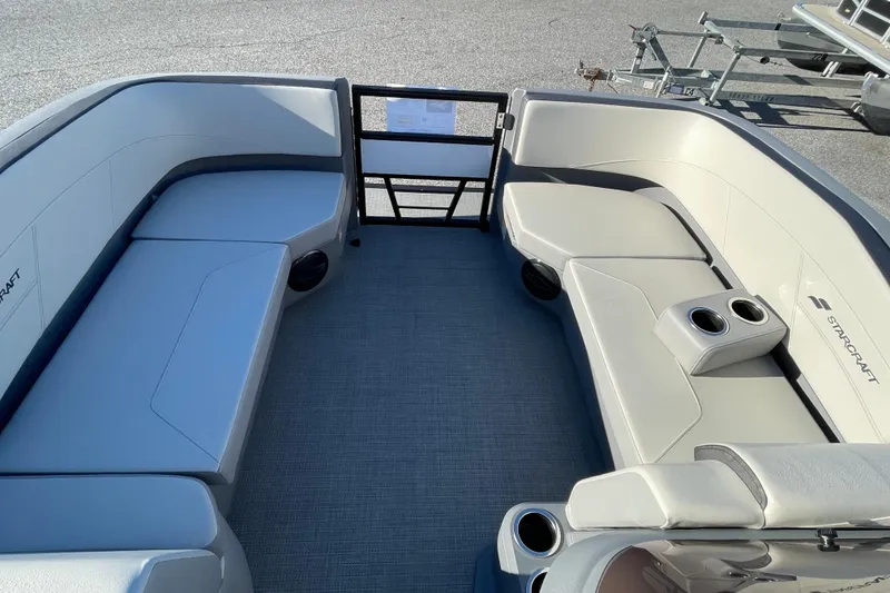 Slide: The Image of 2026 Starcraft GX 16 R boat interior with spacious seating and cup holders. - 16