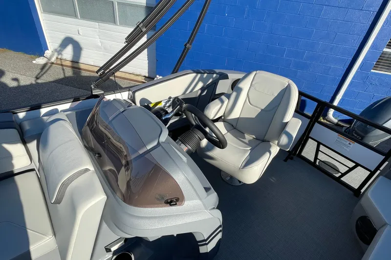 Slide: The Image of 2026 Starcraft GX 16 R boat interior with modern seating and steering console. - 5