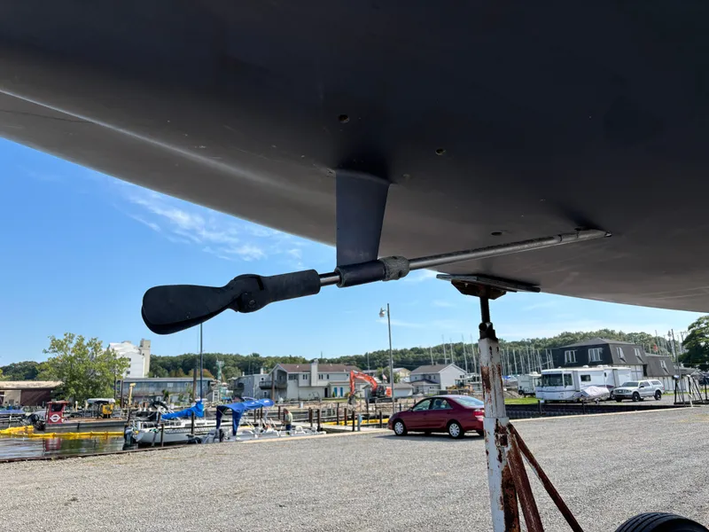 Slide: The Image of Close-up of a 1987 Goman Express 35 sailboat propeller on a stand in a marina. - 12