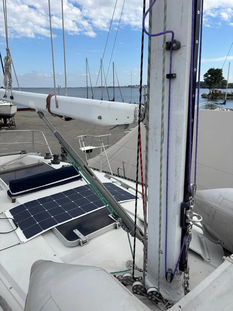 Slide: The Image of Sailboat deck with solar panels, Goman Express 35, 1987, docked by the sea. - 21