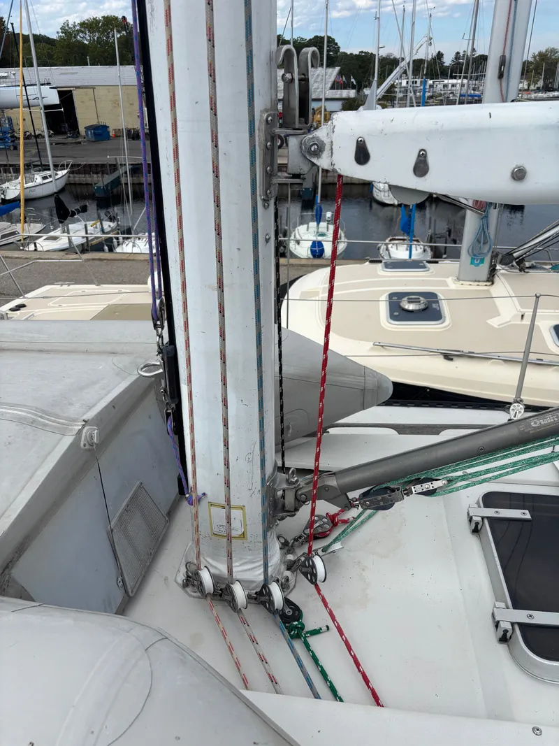 Slide: The Image of Sailboat deck with mast and rigging, Goman Express 35, 1987 model, docked at marina. - 31