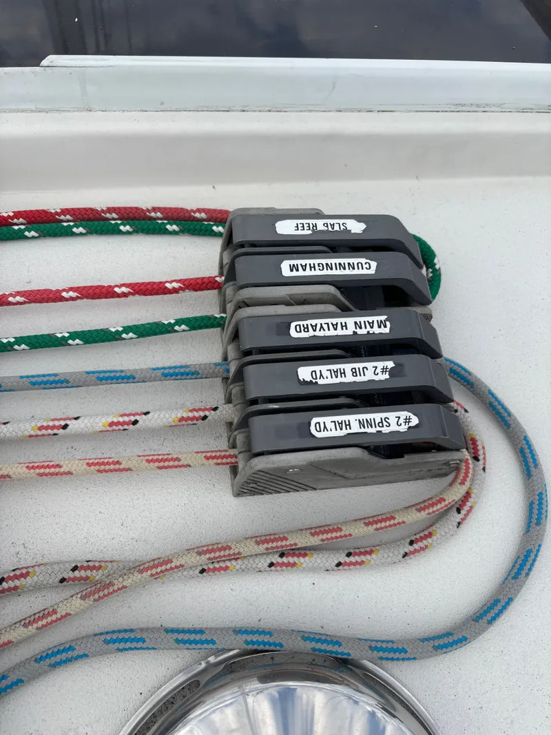 Slide: The Image of Colorful sailing ropes and labeled clutches on a 1987 Goman Express 35 yacht. - 35