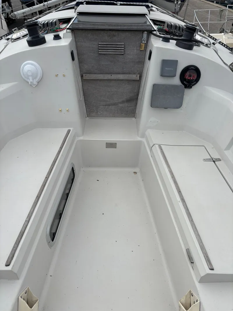 Slide: The Image of Cockpit of 1987 Goman Express 35 sailboat, featuring seating and control panels. - 36