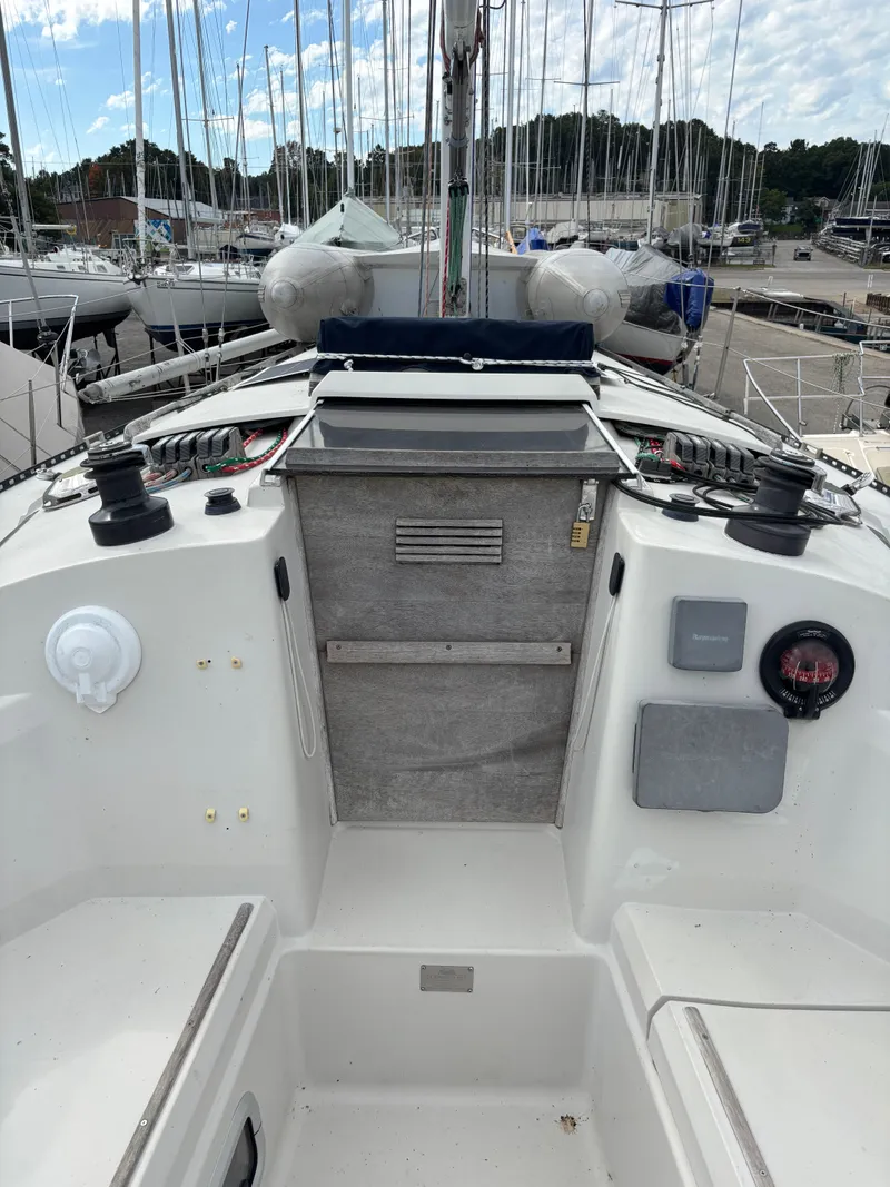 Slide: The Image of Cockpit of 1987 Goman Express 35 sailboat in marina setting. - 37