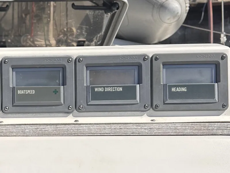 Slide: The Image of Instrumentation panel on a 1987 Goman Express 35, displaying boatspeed, wind direction, and heading. - 45