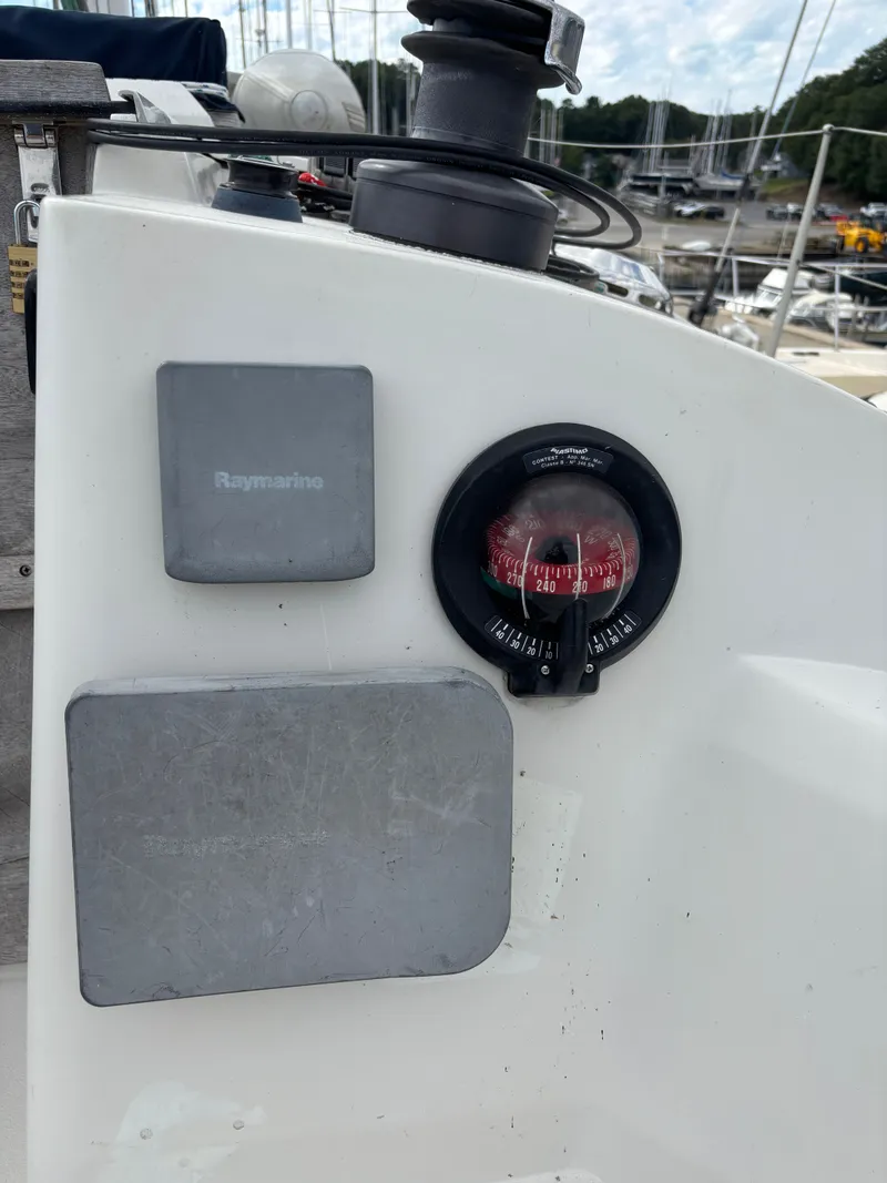 Slide: The Image of Compass and navigation equipment on 1987 Goman Express 35 sailboat deck. - 49