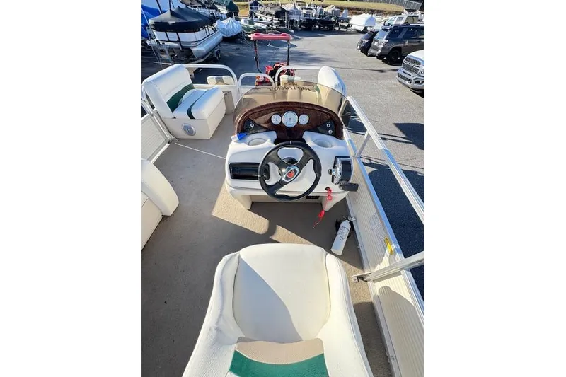 Slide: The Image of 2010 Sun Tracker Party Barge 20 Classic Series interior with steering console and seating. - 10
