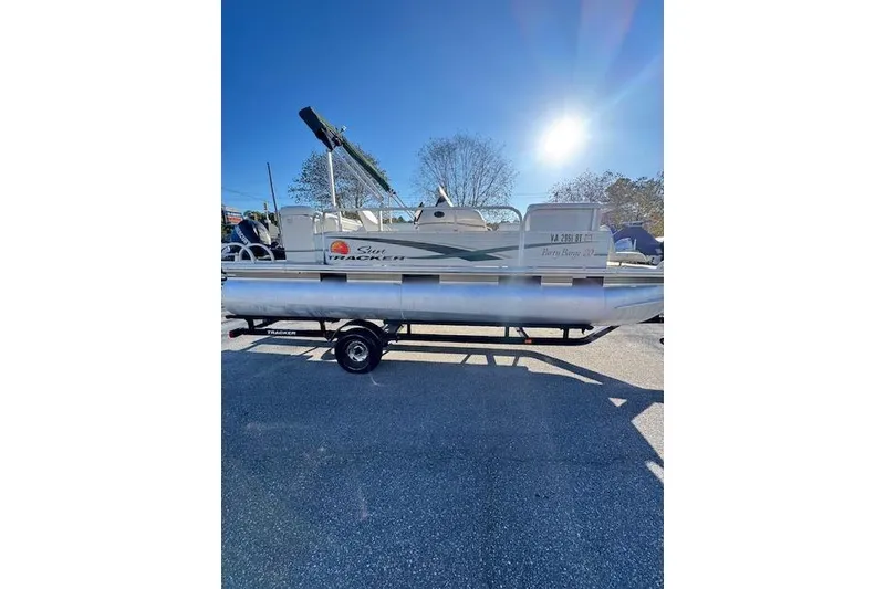 Slide: The Image of 2010 Sun Tracker Party Barge 20 Classic pontoon boat on trailer, sunny day. - 4