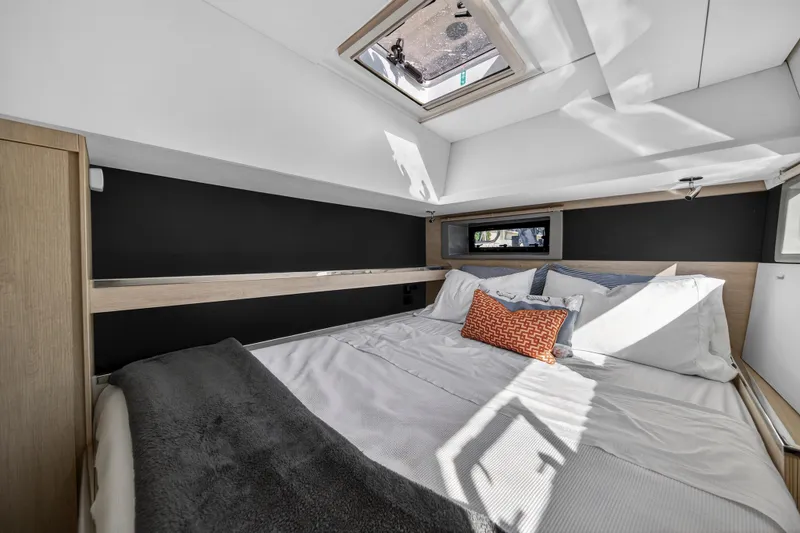 Slide: The Image of Luxurious bedroom interior of 2019 Leopard 45 yacht with skylight and modern decor. - 100