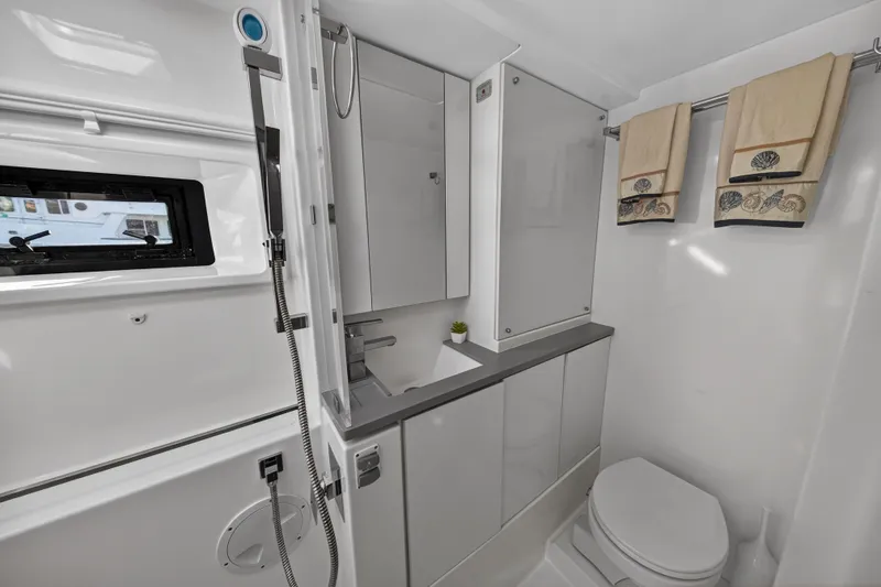 Slide: The Image of Modern bathroom in a 2019 Leopard 45 yacht, featuring sleek design and nautical decor. - 101