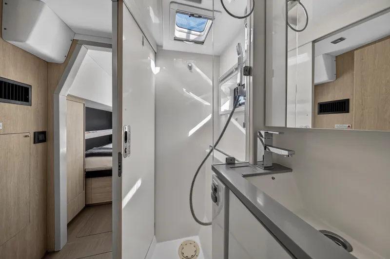 Slide: The Image of Modern bathroom interior on a 2019 Leopard 45 yacht, featuring sleek design and natural lighting. - 102