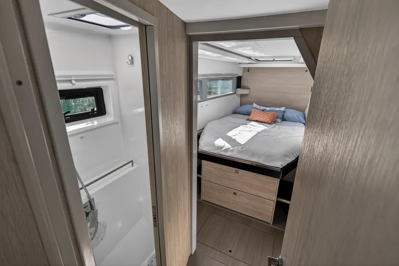 Slide: The Image of 2019 Leopard 45 yacht interior with cozy bedroom and adjacent bathroom. - 103