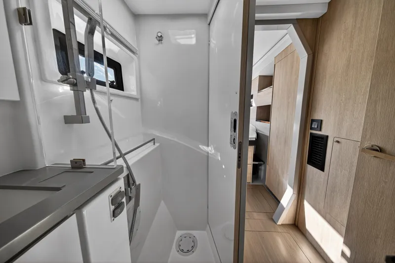Slide: The Image of Modern bathroom interior on 2019 Leopard 45 yacht, featuring sleek design and wooden accents. - 109
