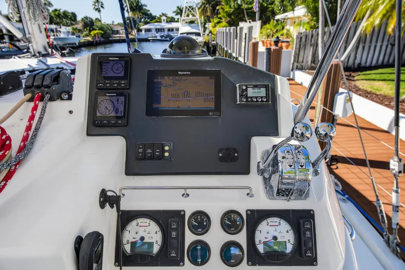 Slide: The Image of Control panel of a 2019 Leopard 45 yacht with navigation instruments and throttle levers. - 11