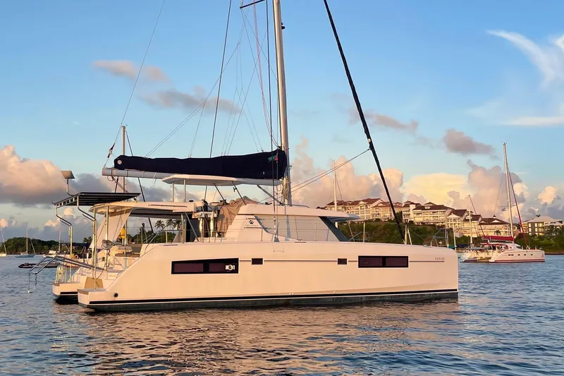 Slide: The Image of 2019 Leopard 45 catamaran sailing on calm waters at sunset. - 110