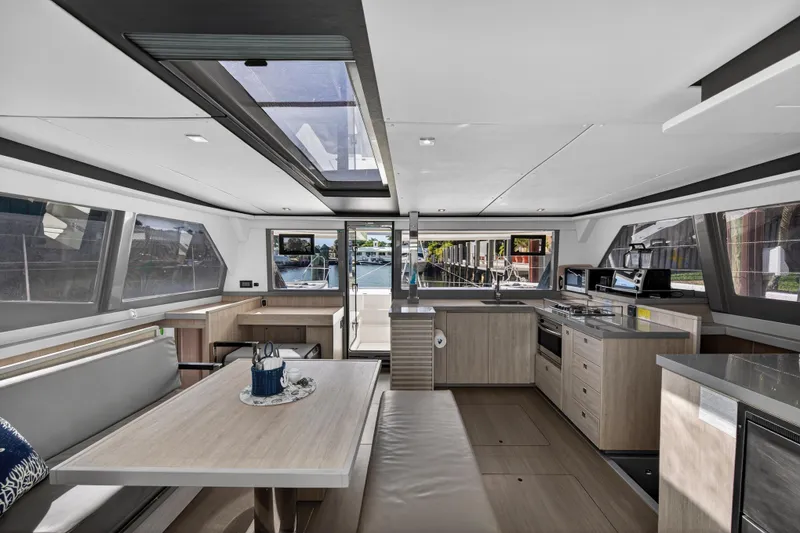 Slide: The Image of Luxurious interior of a 2019 Leopard 45 catamaran with modern kitchen and dining area. - 17